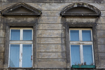 Two vintage front glass windows of an old house