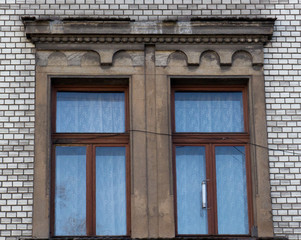 Two vintage front glass windows of an old house