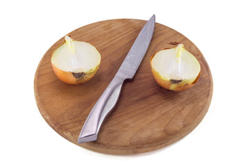Two halves of onion on kitchen board isolated