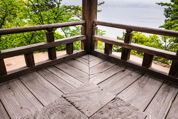 Wooden corner of Senjokaku (Toyokuni Shrine) on Miyajima Island.