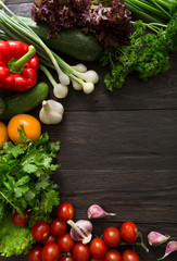 Fresh vegetables on brown wood background with copy space