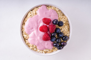 Oatmeat in bowl with yogurt and berries