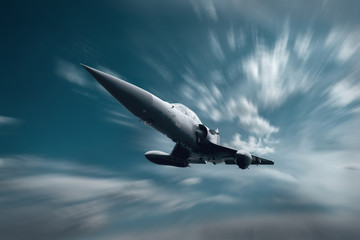 Fototapeta na wymiar Military airplan on the speed in the sky