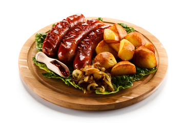 Grilled sausages served on cutting board