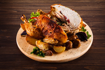 Roast chicken on cutting board