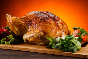 Roast chicken on cutting board