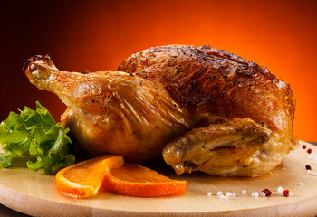 Roast chicken on cutting board