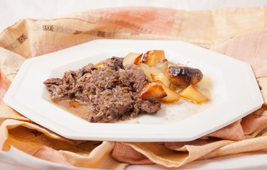 Braised beef with potatoes and onions.