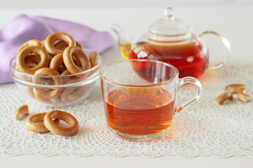 Bagels and glass cup of black tea.