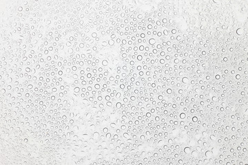 Water drops on glass, Rain droplets on glass background.