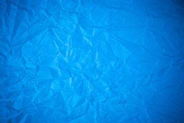 Blue paper crumpled recycle background.