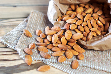 Almonds, poured out of a paper bag.