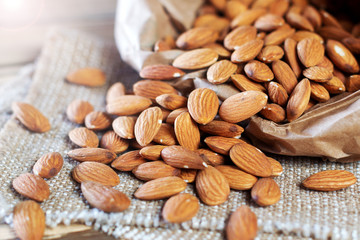 Almonds, poured out of a paper bag.