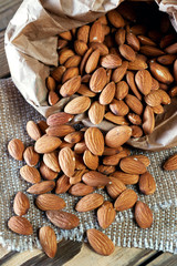 Almonds, poured out of a paper bag.