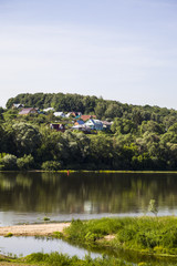 beautiful landscape with a river and a sandy beach on a summer day.
