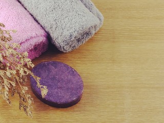 colorful hand made soap with towel on space background