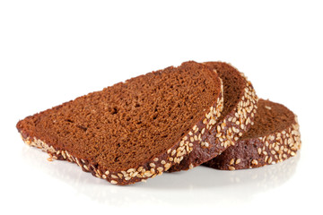 Three slices of black bread with sesame seeds isolated on white background