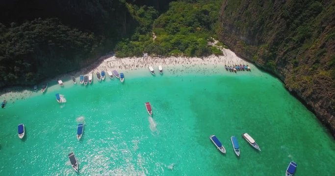 Tour Boats Moored in Maya Bay, Phi Phi Islands, Thailand, Drone Shot
