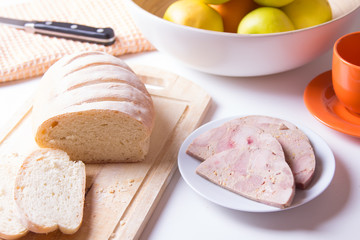 Homemade ham from chicken and homemade white bread. Breakfast. Selective focus.