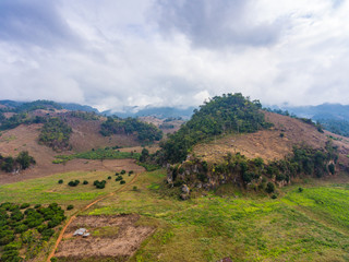 Fototapeta premium Aerial view of Small mountain and farm in country area
