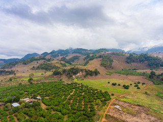 Aerial view of Small mountain and farm in country area