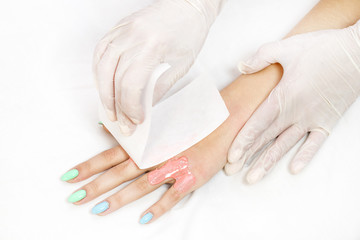 Obraz na płótnie Canvas Process depilation female legs and hands in a beauty salon