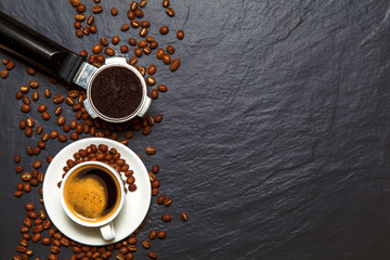 Coffee background - top view. Coffee in a holder and coffee beans