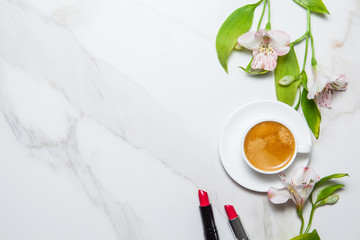 Morning romantic breakfast. Coffee and flowers on marble background. Top view