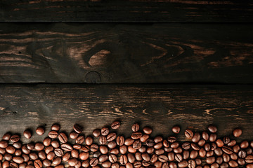 coffee beans on table black wood.