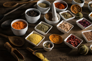 Various of colorful spices on wooden table. place for typography