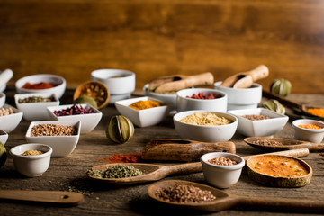 Various of colorful spices on wooden table. place for typography