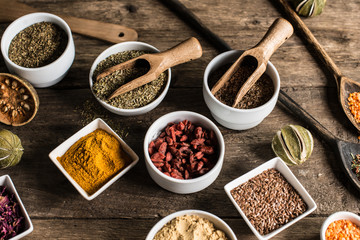 Various of colorful spices on wooden table. place for typography