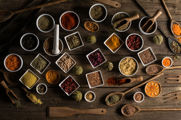 Various of colorful spices on wooden table. place for typography