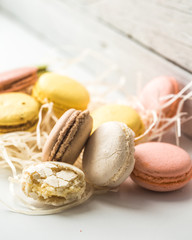 Colorful macaroons on wooden background