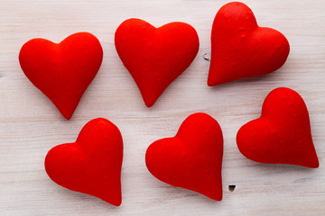 Red hearts the gray background. Valentine Day background.