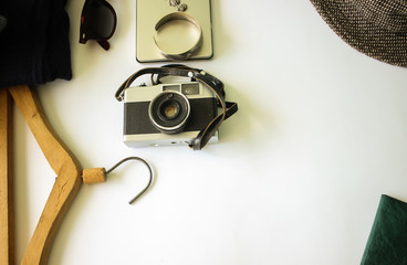 Fototapeta na wymiar Photo camera, purse and vintage hat, passport for traveler style kit on white background