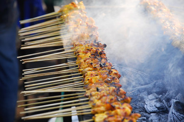 Delicious Asian Cuisine, Malaysia Chicken Satay Cooking on a Hot Charcoal Grill