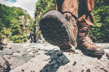 Feet trekking boots hiking Traveler alone outdoor wild nature Lifestyle Travel extreme survival...