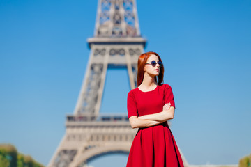 beautiful young woman on the Eiffel Tower background