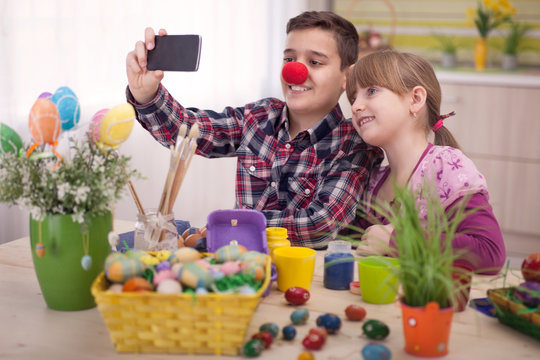 boy and girl  taking selfie at Easter time