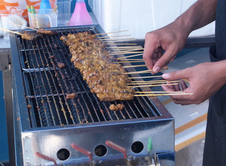 Delicious Asian Cuisine, Malaysia Chicken Satay Cooking on a Hot Charcoal Grill