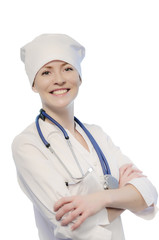 Young woman medical doctor portrait in white coat and cap with stethoscope isolated on white background.