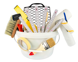 paint bucket filled with handyman renovation tools paint and equipment isolated on white background...