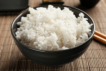 Bowl of rice on bamboo mat