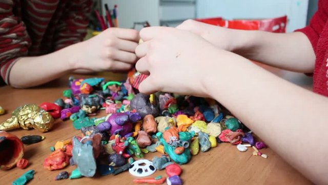 Children playing with colorful plasticine in the creative studio