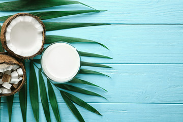 Composition with fresh coconut milk on wooden background
