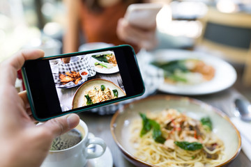 Taking photo on the food in restaurant