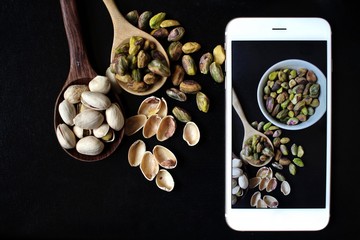 Taking a photo of pistachio with smart phone