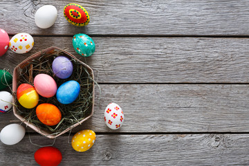 Colorful easter eggs on wood background