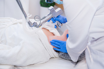 Close up process of laser peeling. Laser rejuvenation and skin treatment of problematic skin in the...
